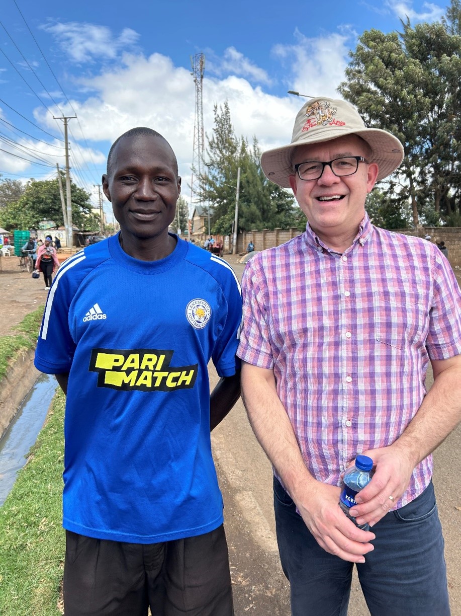 Iain is pictured with Emukule, a Leicester City supporter in Kawangware. 